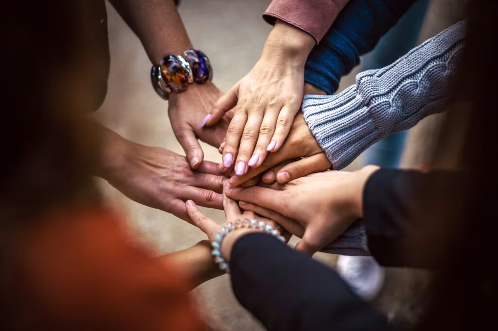 A group of people supporting each other during a time of loss or memorial service