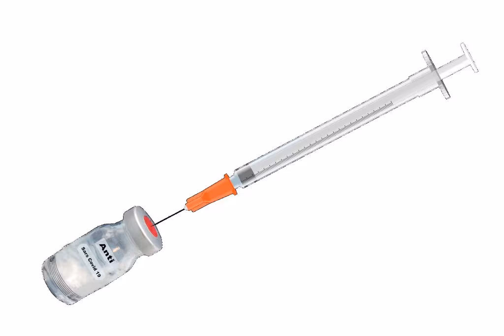 A healthcare worker holding a COVID-19 mRNA vaccine vial and syringe ready for administration.