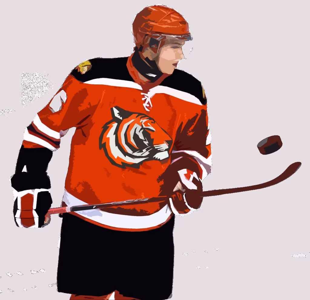 A hockey defenseman controlling the puck and looking up the ice during a fast break.