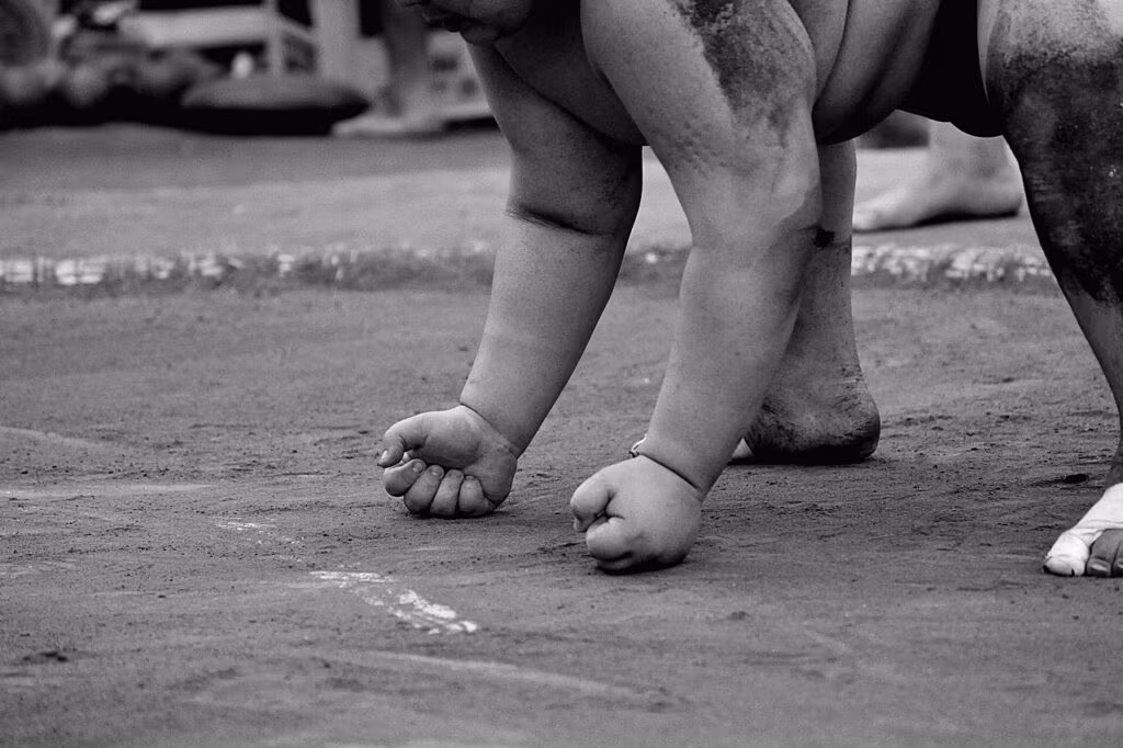 A professional wrestling ring under bright lights, symbolizing Steveson's WWE commitments.
