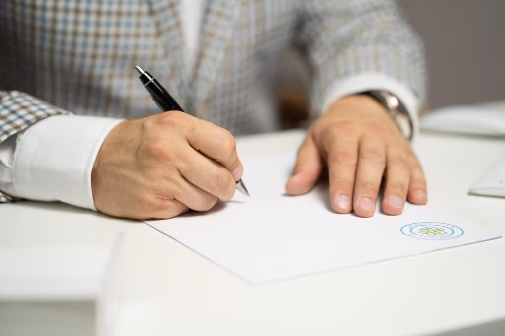 Close-up of a signed financial document marked 'Resolved' or 'Paid' indicating the settlement of a large tax debt.