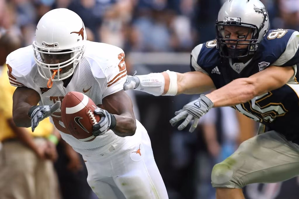 NFL running back celebrating after scoring a touchdown in a football game