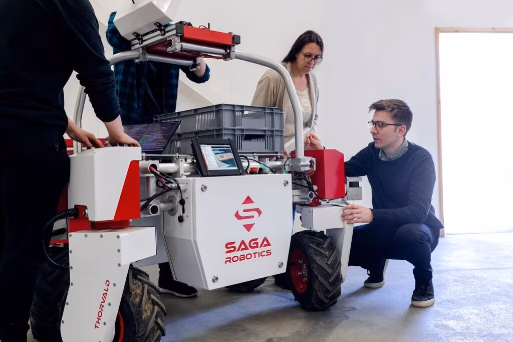 Software engineers collaborating on code fixes in a modern office environment