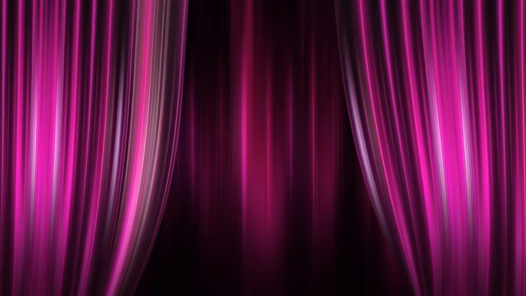 A brightly lit movie theater marquee displaying a successful film title and crowded lobby.