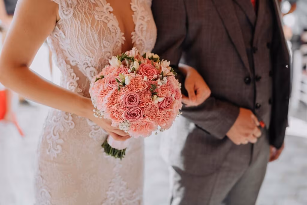 A close-up image of a couple's hands showing new wedding rings, symbolizing Jon Gosselin's second marriage.