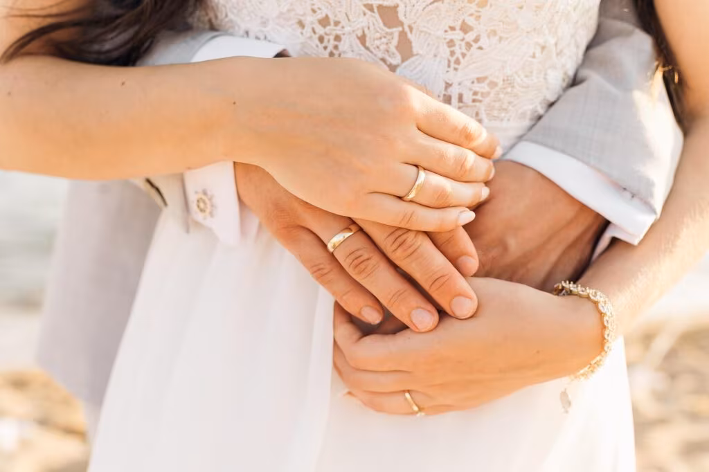 A happy couple embracing, celebrating a relationship milestone, symbolizing nearly ten years of marriage and partnership.