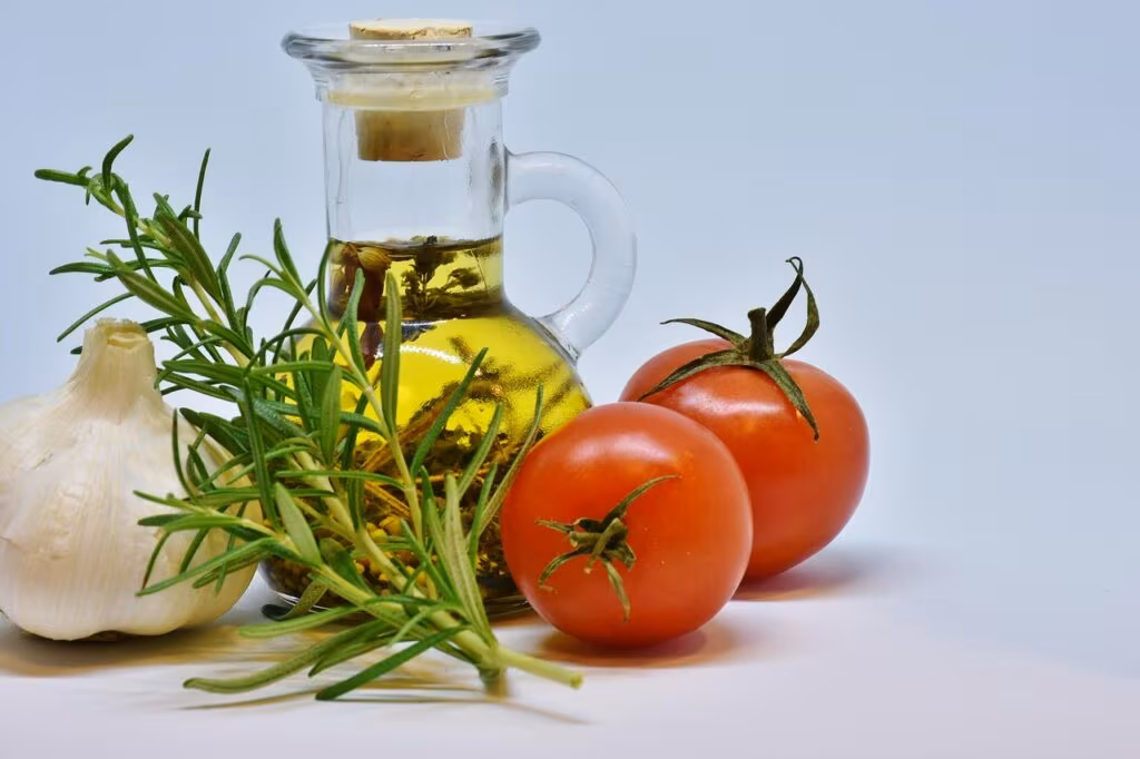 A healthy meal prep featuring salmon, spinach, blueberries, and olive oil, representing an anti-inflammatory diet