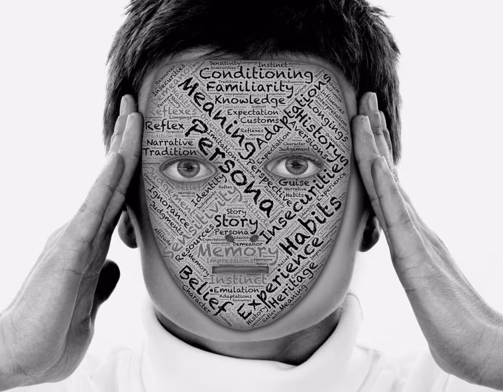 A person holding a mask, symbolizing the facade of confidence used by vulnerable narcissists to hide their true feelings.