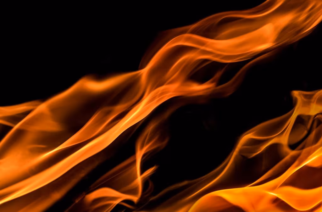Abstract image of a fiery red and orange background, representing the Aries element of fire and the need for courage.