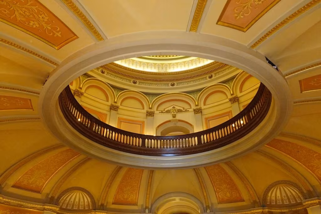 California Governor Gavin Newsom speaking at a podium during a political event.