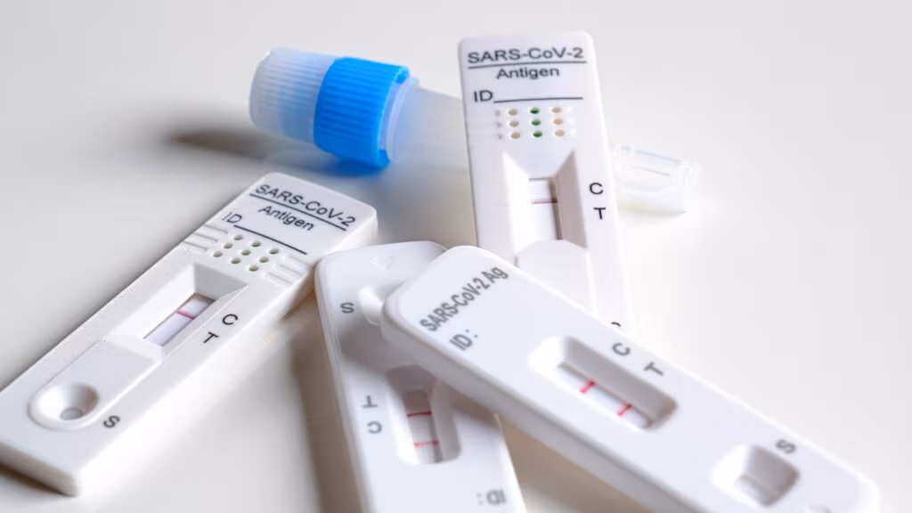 Close-up of a rapid antigen COVID-19 test kit showing a negative result line.