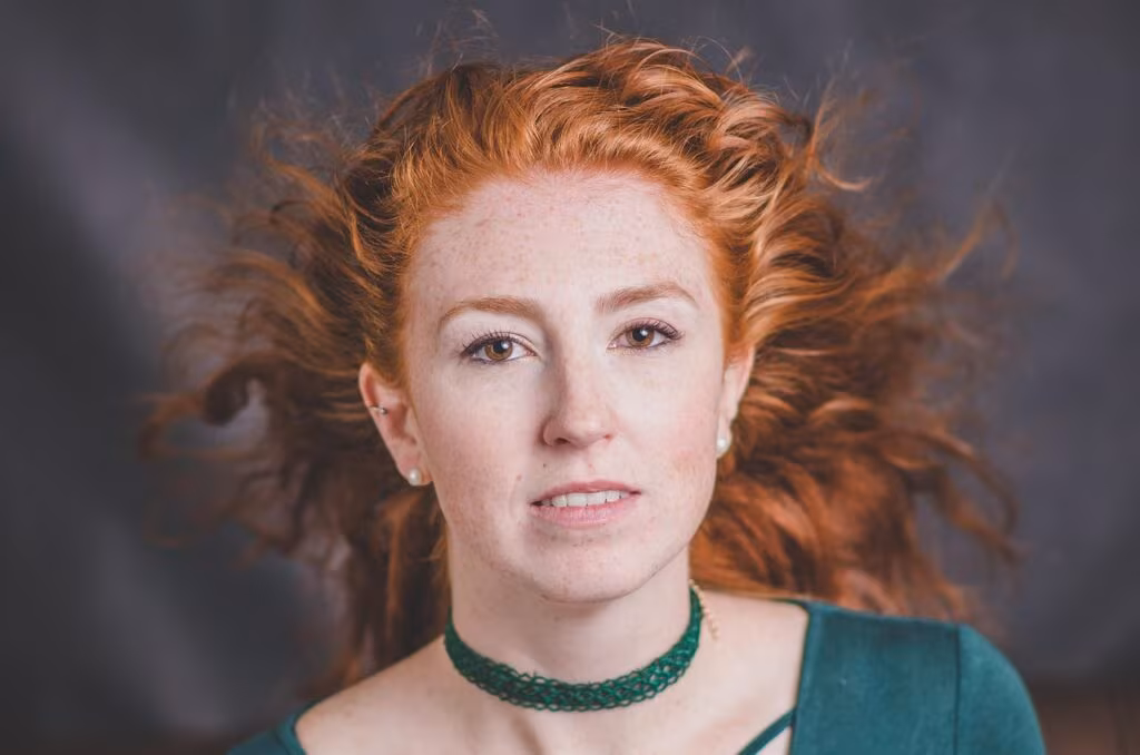 Close-up professional portrait of actress Millie Bobby Brown smiling