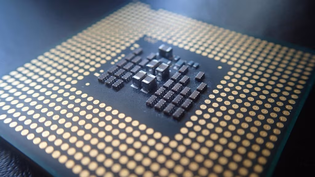 Close-up view of an advanced Apple Silicon microchip on a circuit board, highlighting the complexity of the processor.