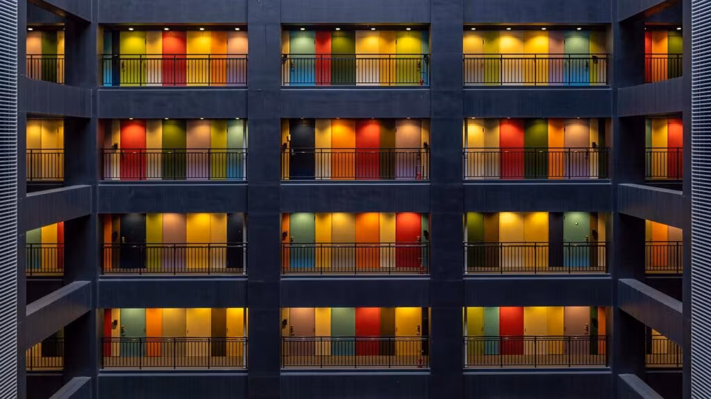 Contemporary house exterior clad in dark slate shingles creating a textured, scaly appearance