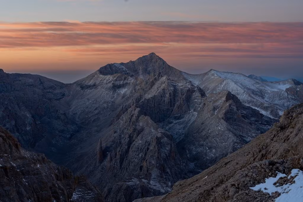 Delegates negotiating at a large climate summit table, looking tired