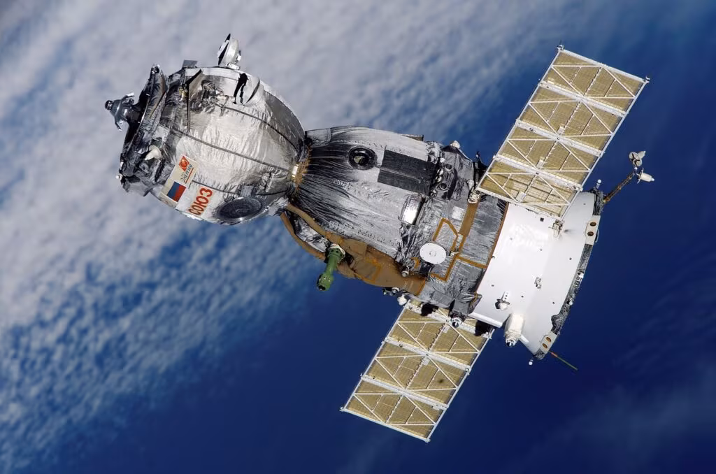 Exterior view of the International Space Station showing a scientific exposure platform mounted on the hull