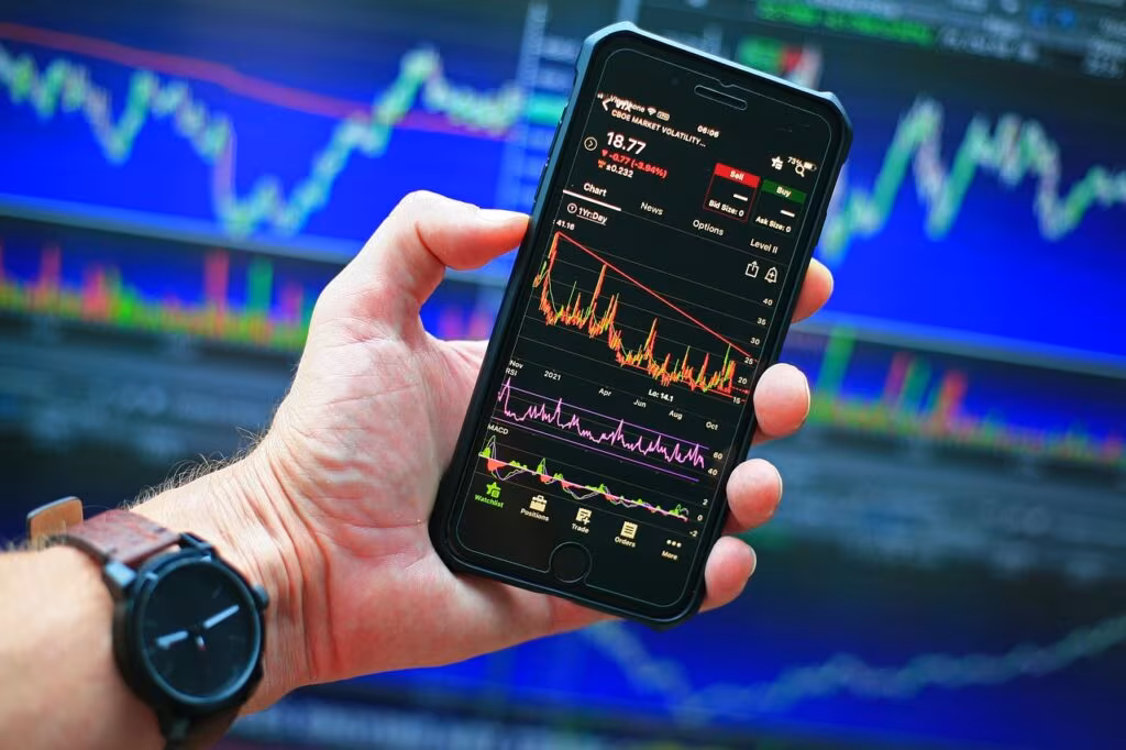 Financial analyst reviewing complex stock market data and charts in a modern office setting.