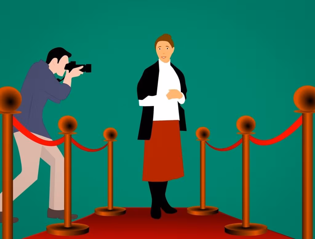 Jeremy Renner on a red carpet at a film premiere, surrounded by flashing cameras.