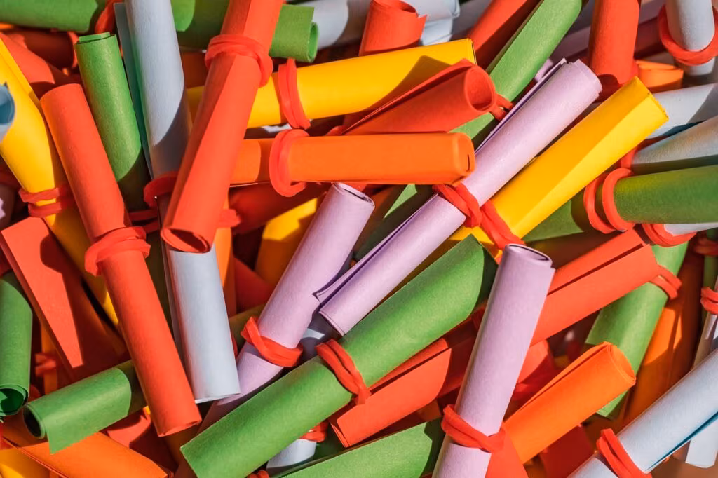 Mega Millions lottery balls being drawn from a machine, symbolizing the massive $900 million jackpot.
