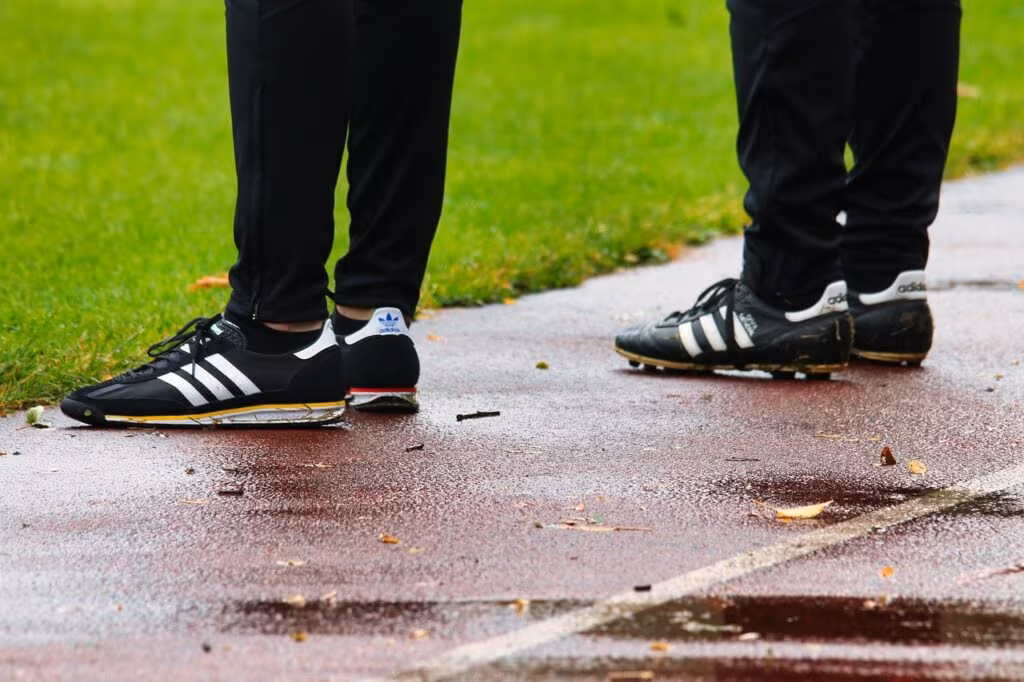 Mike McDaniel coaching the Miami Dolphins from the sideline during an NFL game.