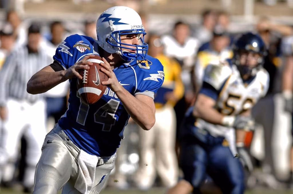 New England Patriots quarterback Drake Maye running with the football during a game.
