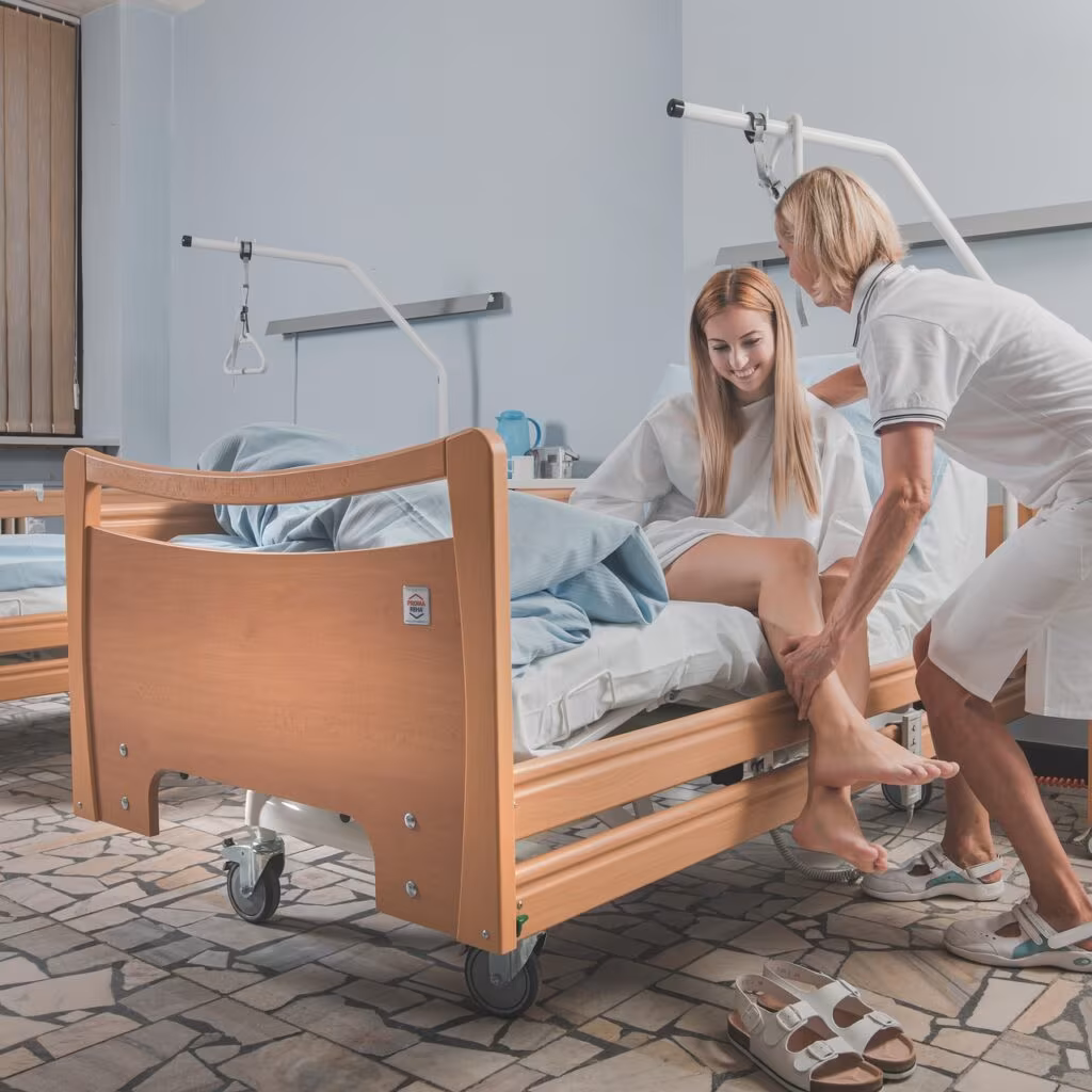 Patient recovering in a hospital bed after a heart attack, emphasizing the importance of long-term care strategies.