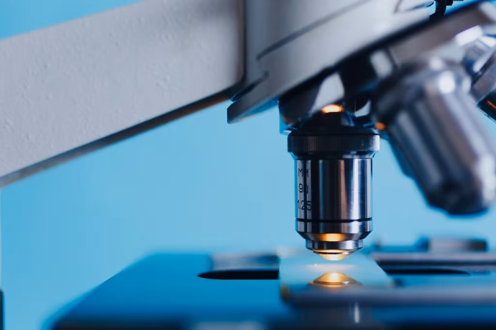 Scientist analyzing calcite core samples in a paleoclimatology laboratory using mass spectrometry