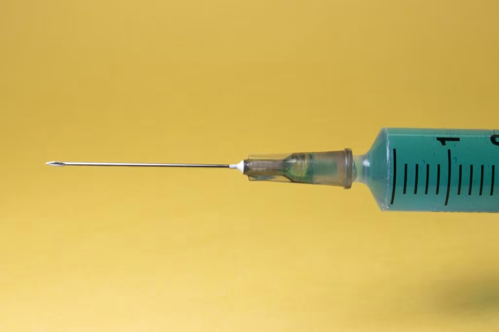 Semaglutide injection pen next to laboratory equipment, symbolizing the clinical trial.