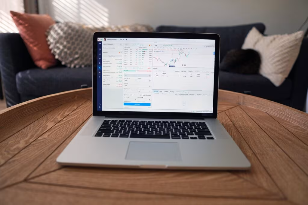 Stock market trading screen showing green and red charts and data analysis