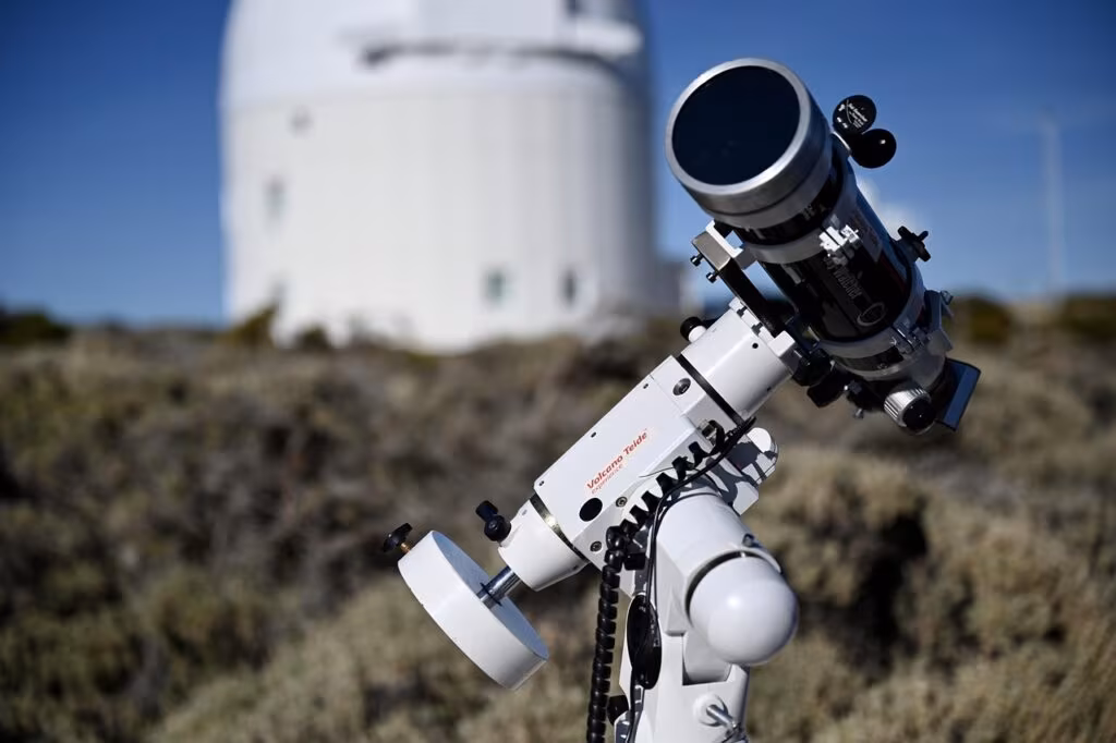 The massive dome of the Vera C. Rubin Observatory against a dark, starry sky.