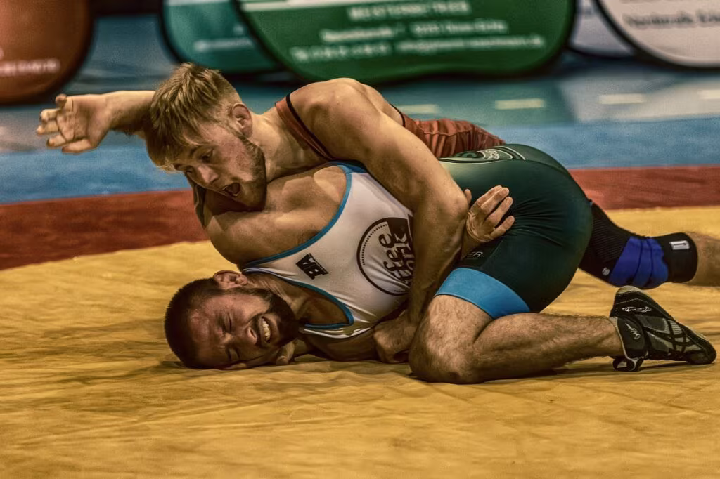Two mixed martial arts fighters facing off intensely before a match