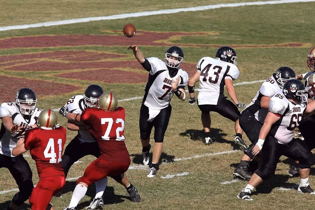 University of California quarterback Fernando Mendoza throwing the ball during a critical late-game drive.