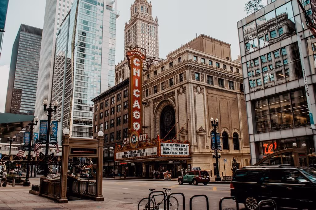 View of State Street in Chicago's Loop at night with bright lights and tall buildings