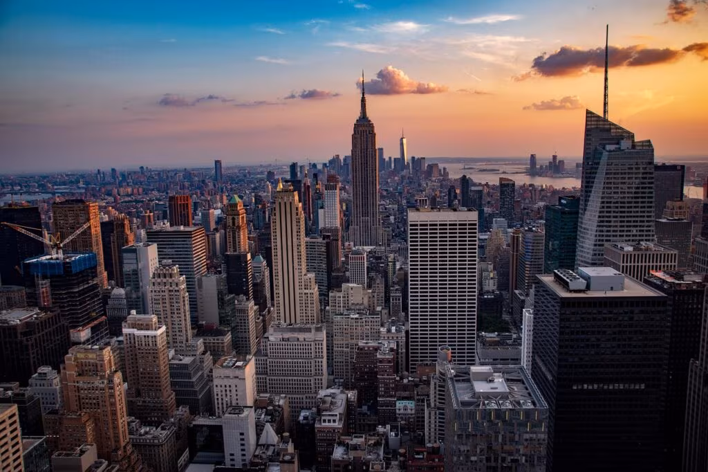 View of the historic glass-enclosed skybridge connecting two buildings over the cobblestone Staple Street in TriBeCa, NYC.